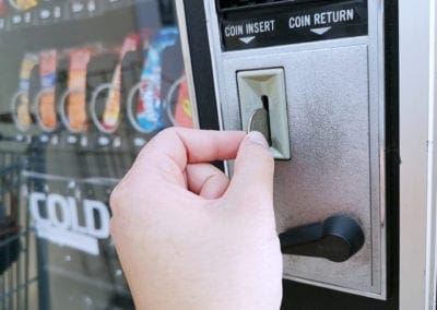 man inserting a coin