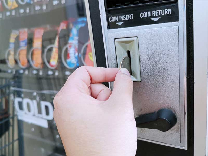 man inserting a coin